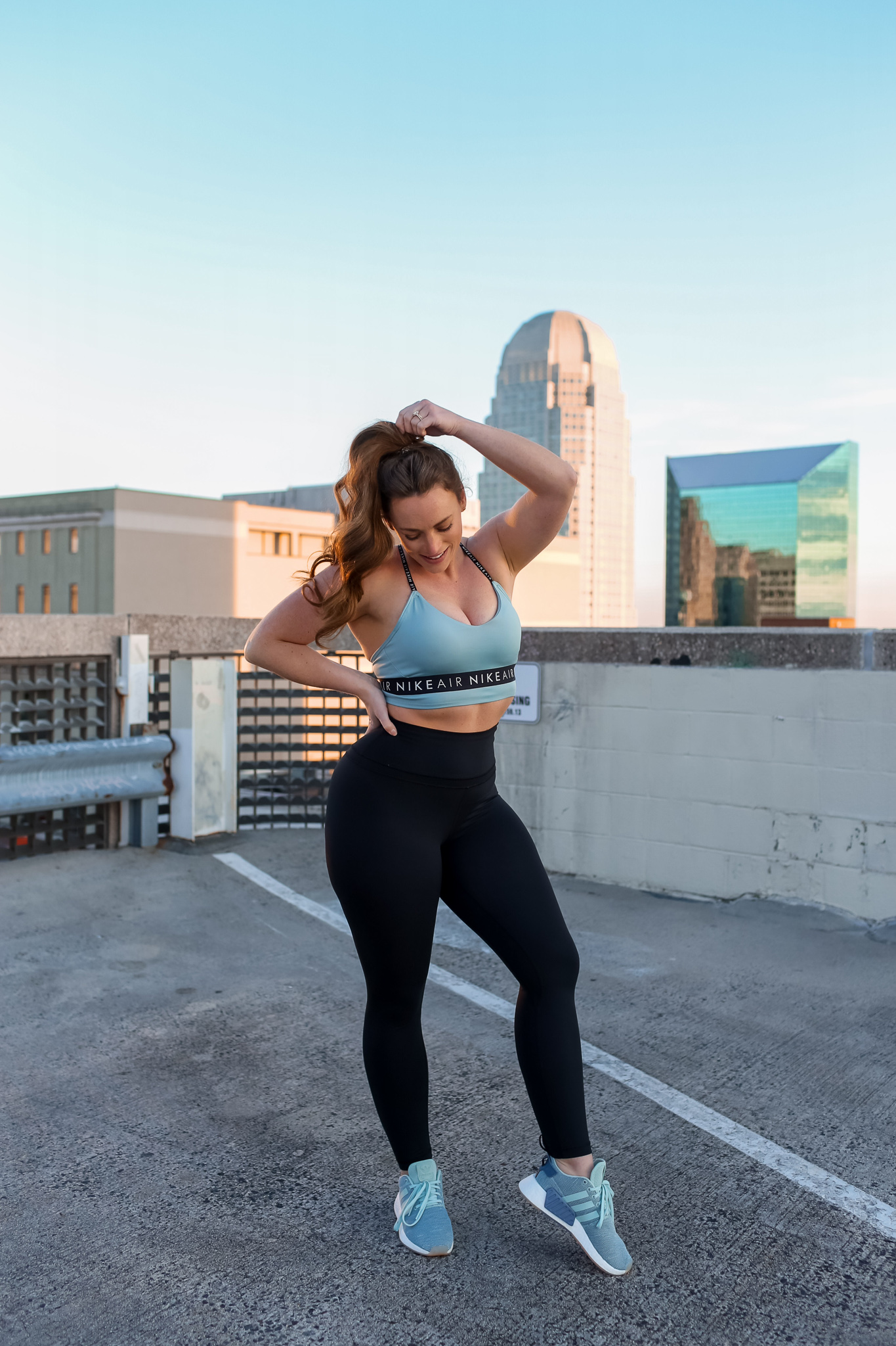 Women working out on top of parking garage